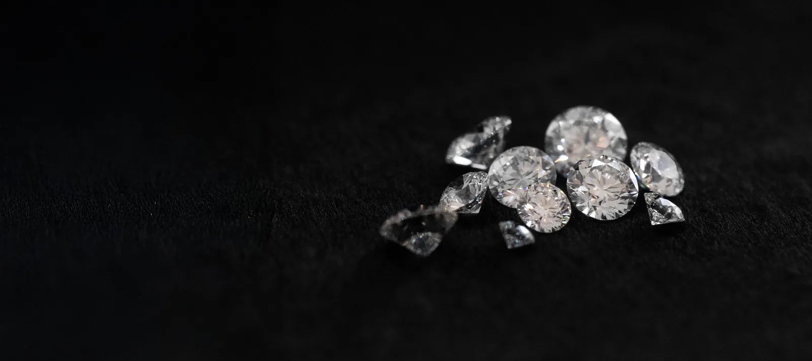 Loose diamonds on dark fabric